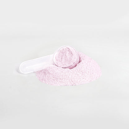 Scoop of Lychee HYDRATION electrolyte powder by Ambedo Wellness, ready to mix for hydration and energy.