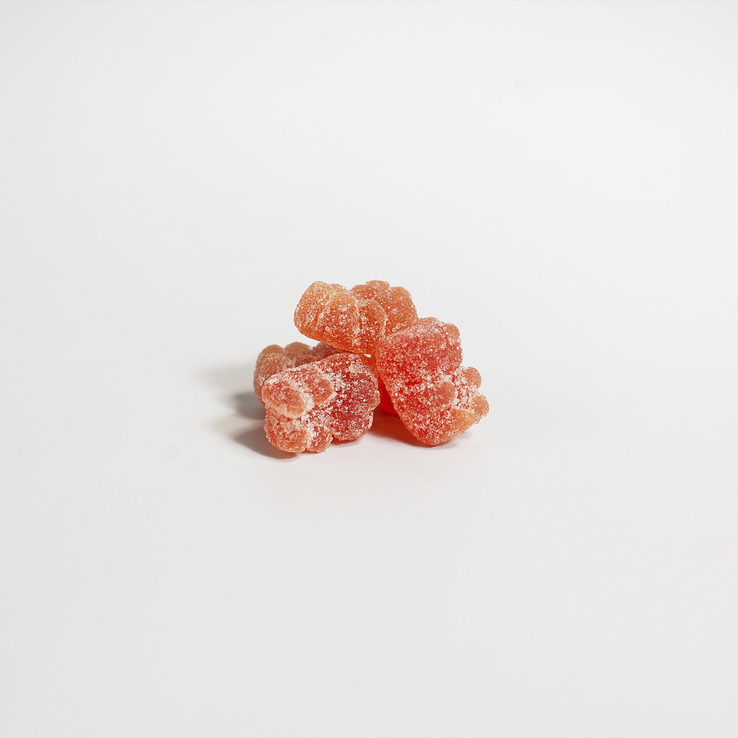 Close-up of VitalBerry Multivitamin Gummies showcasing their natural strawberry flavor and gummy texture.